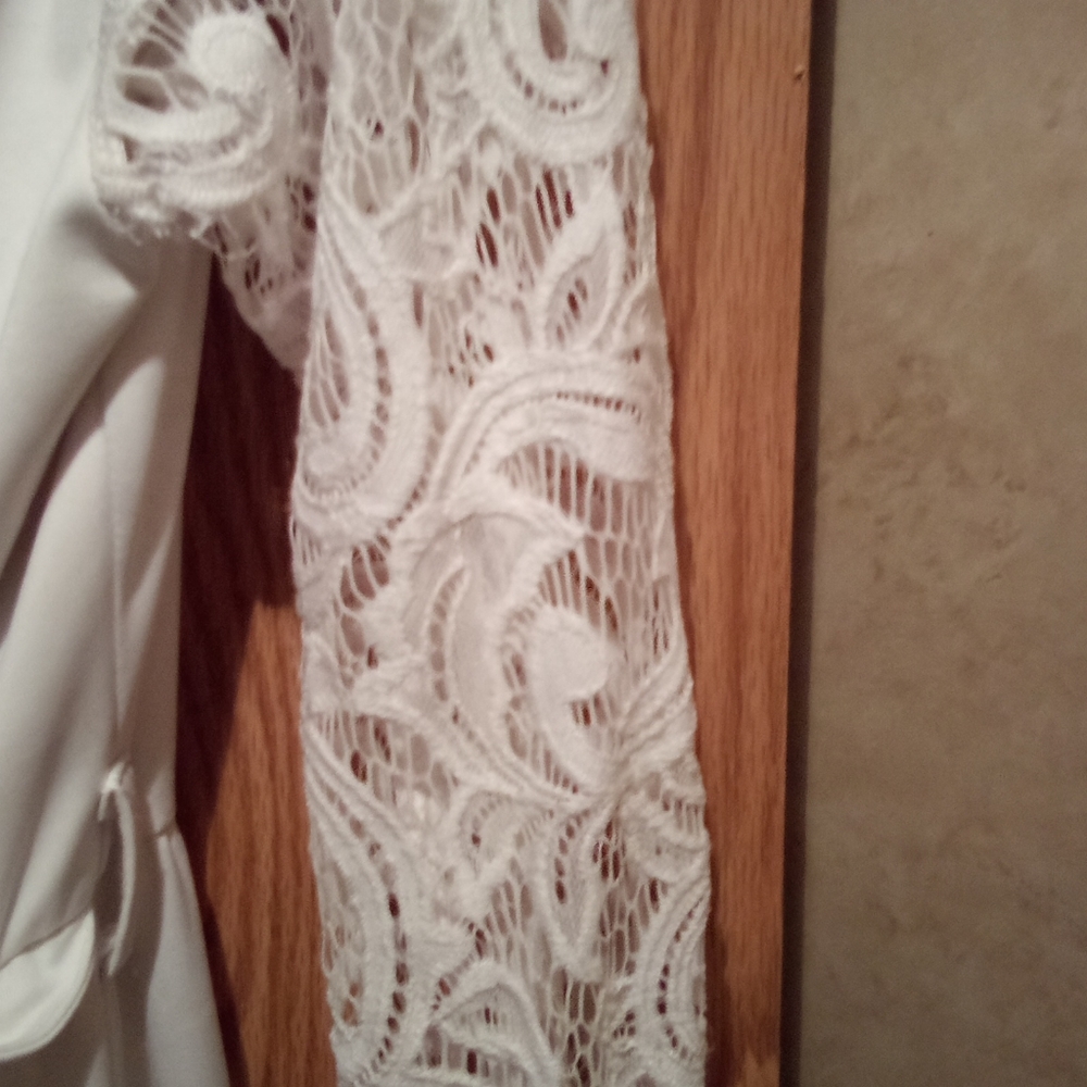 Very long white gown or dress
